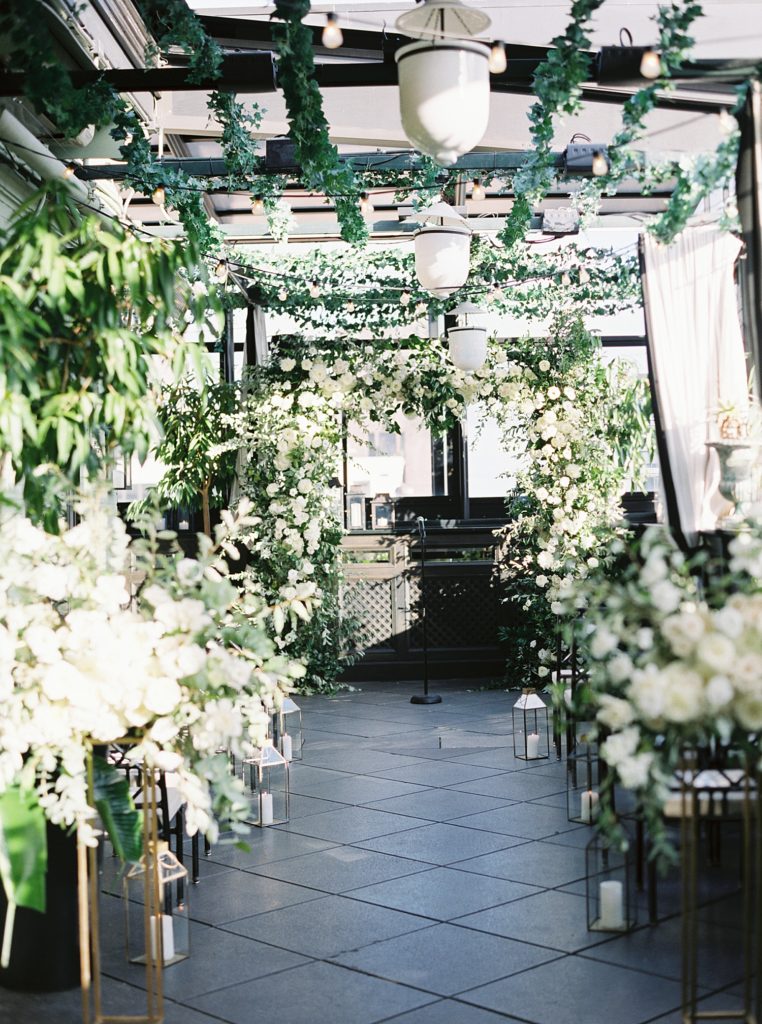 Rooftop ceremony venue full of flowers 