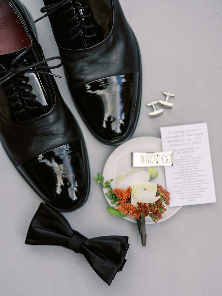 Lay flat of groom's details at a wedding.