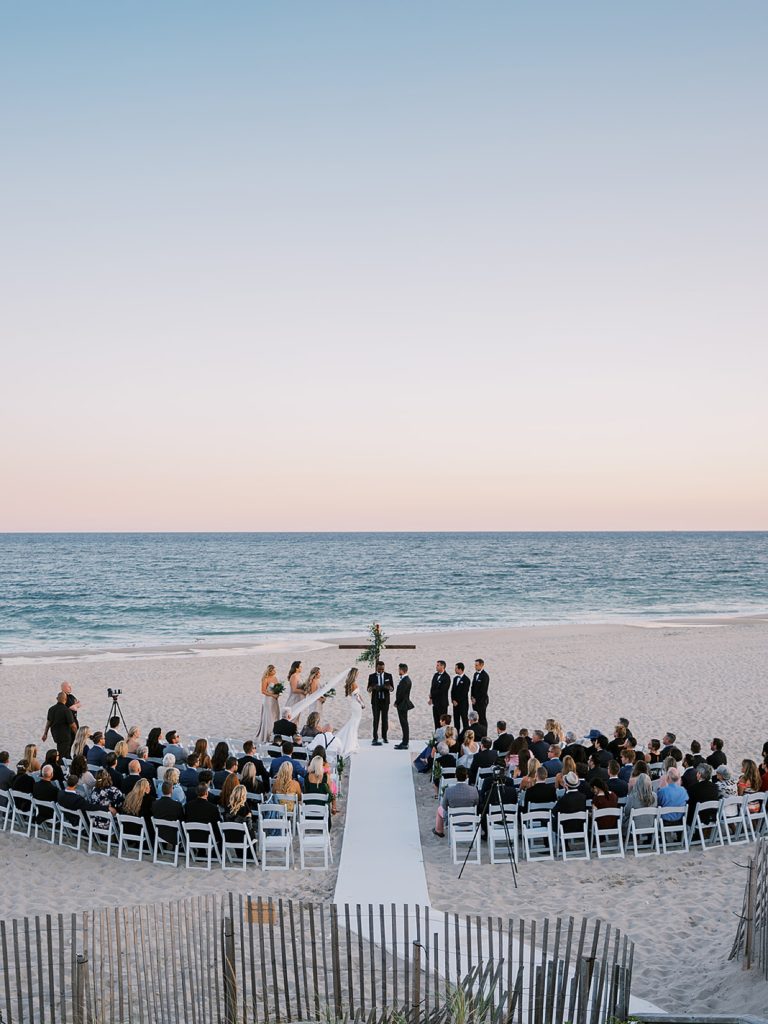 Sunset beach editorial and modern wedding ceremony in Bridgehamptom, New York. 