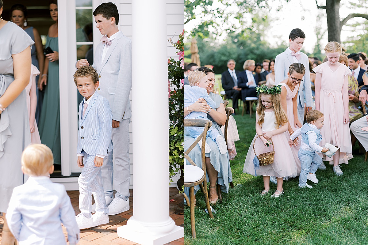 flower girls in pink pastel and flower crowns walk the aisle with ring bearers in blue pastel seersucker suits at outdoor wedding shot by sophie kaye photography