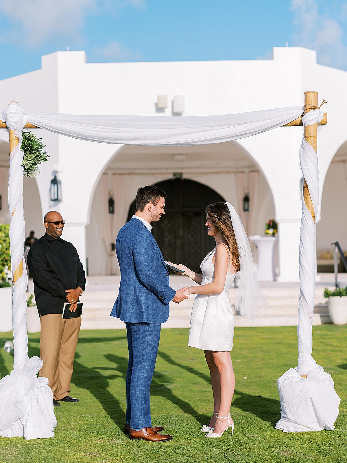 Bride and groom share vows at elopement in Anguilla captured by Sophie Kaye Photography