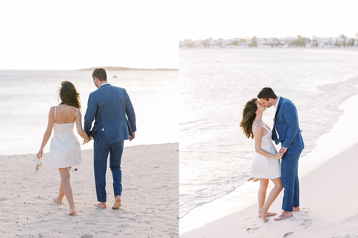 newlywed couple in satin minidress and linen suit walk barefoot at island elopement shot by Sophie Kaye Photography