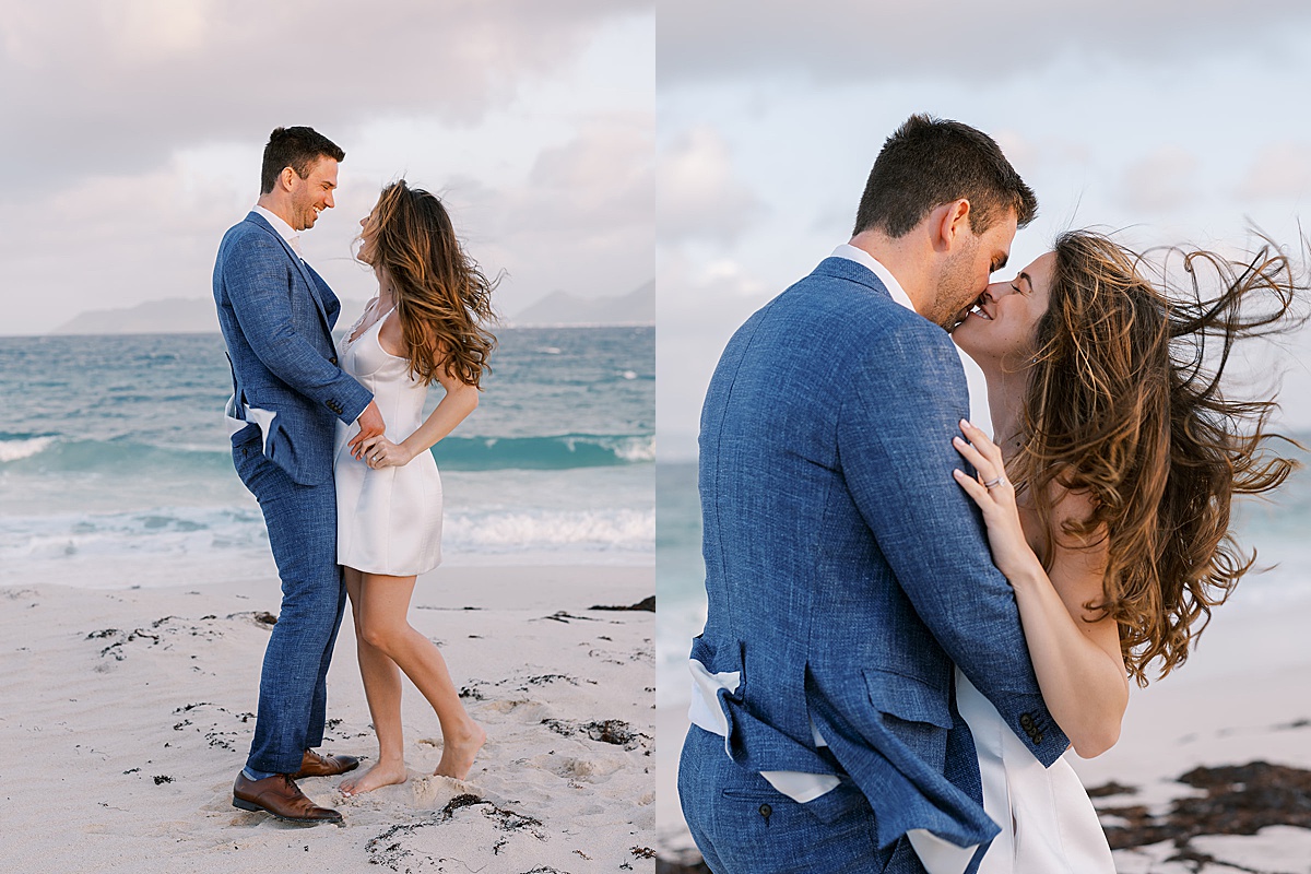 newlywed couple kiss on white sand beach during anguilla elopement shot by destination luxury photographer
