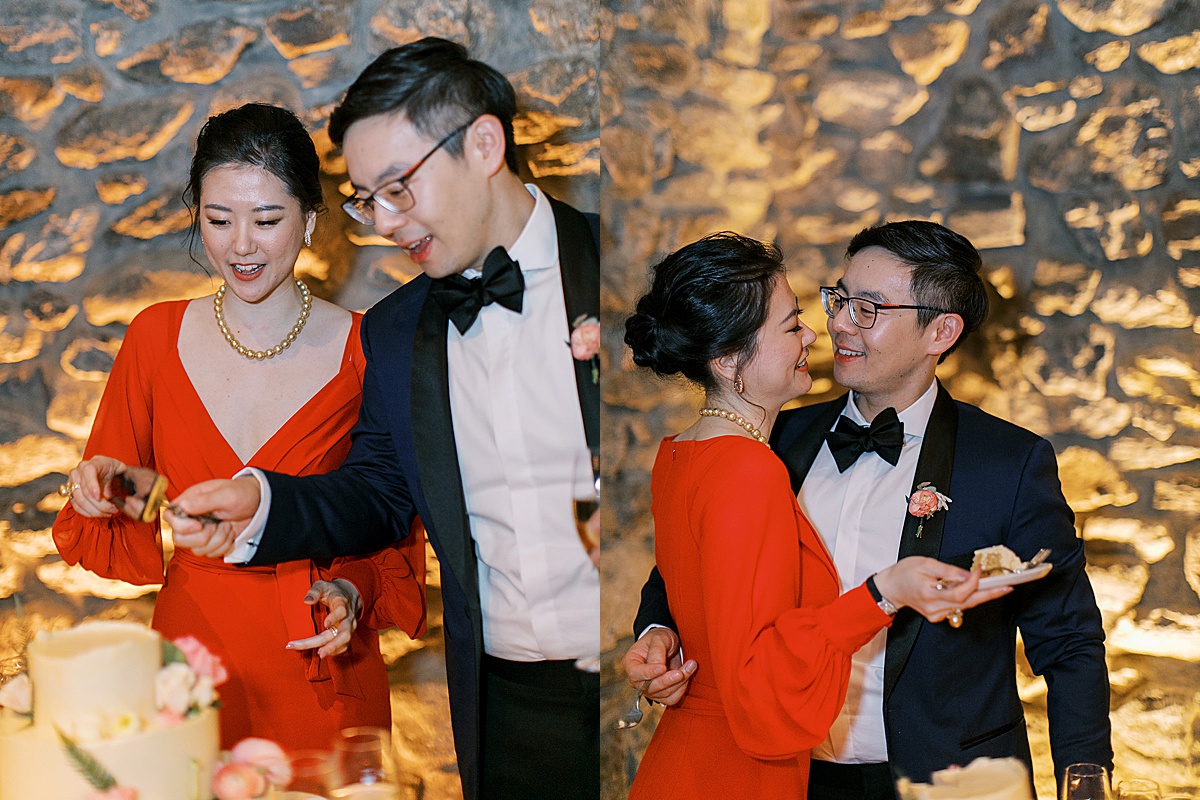 bride dons gorgeous red evening gown and eats cake with groom at new york wedding reception shot by Sophie Kaye Photography